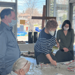 Father David , Sue and Kathleen praying before meeting