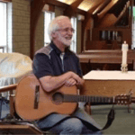 Bruce with his guitar at the Food Pantry